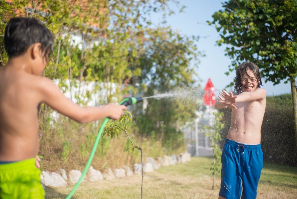 boys with a hose